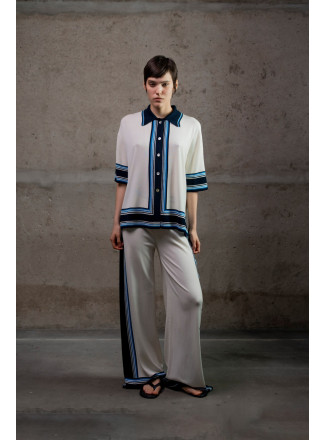 Трикотажні штани з контрастним обрамленням молочні