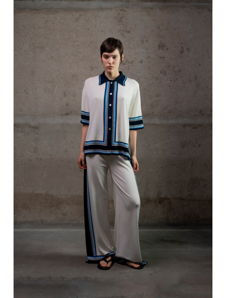 Трикотажні штани з контрастним обрамленням молочні