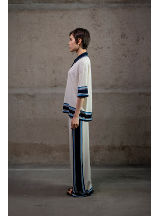 Трикотажні штани з контрастним обрамленням молочні