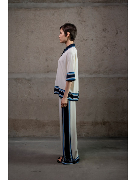 Трикотажні штани з контрастним обрамленням молочні