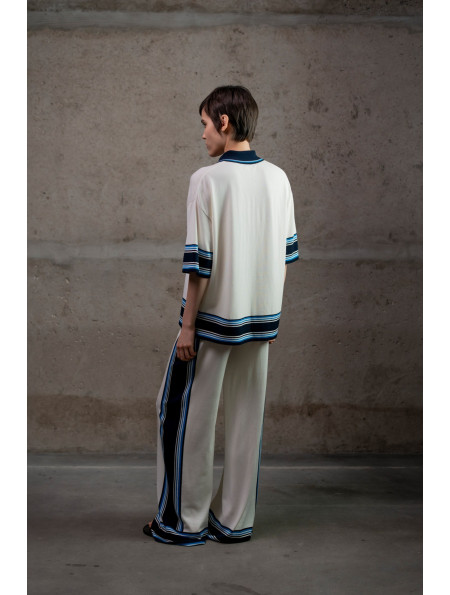 Трикотажні штани з контрастним обрамленням молочні