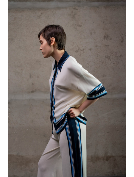 Трикотажні штани з контрастним обрамленням молочні