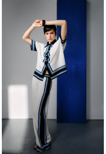 Трикотажні штани з контрастним обрамленням молочні